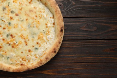 Delicious cheese pizza on wooden table, top view. Space for text