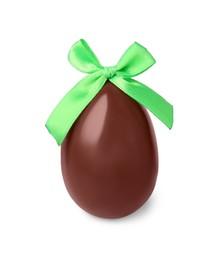 Photo of Tasty chocolate egg with green bow isolated on white