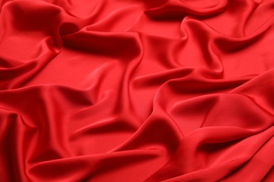 Texture of delicate red silk as background, closeup