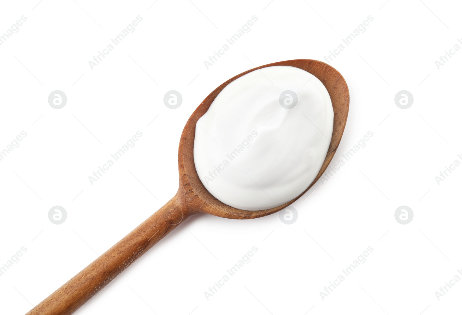 Photo of Spoon with creamy yogurt on white background, top view