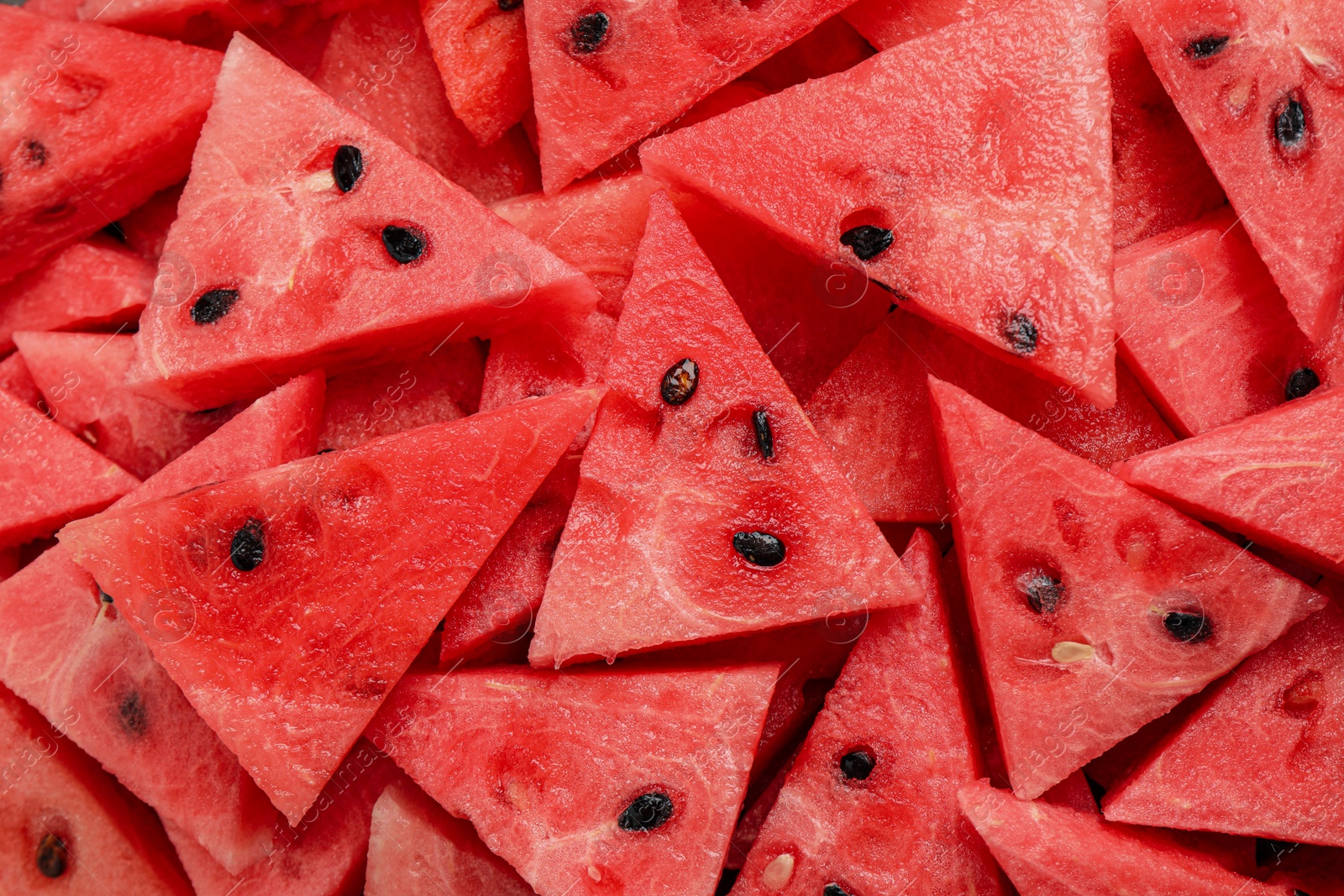 Photo of Delicious fresh watermelon slices as background, closeup