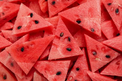 Photo of Delicious fresh watermelon slices as background, closeup