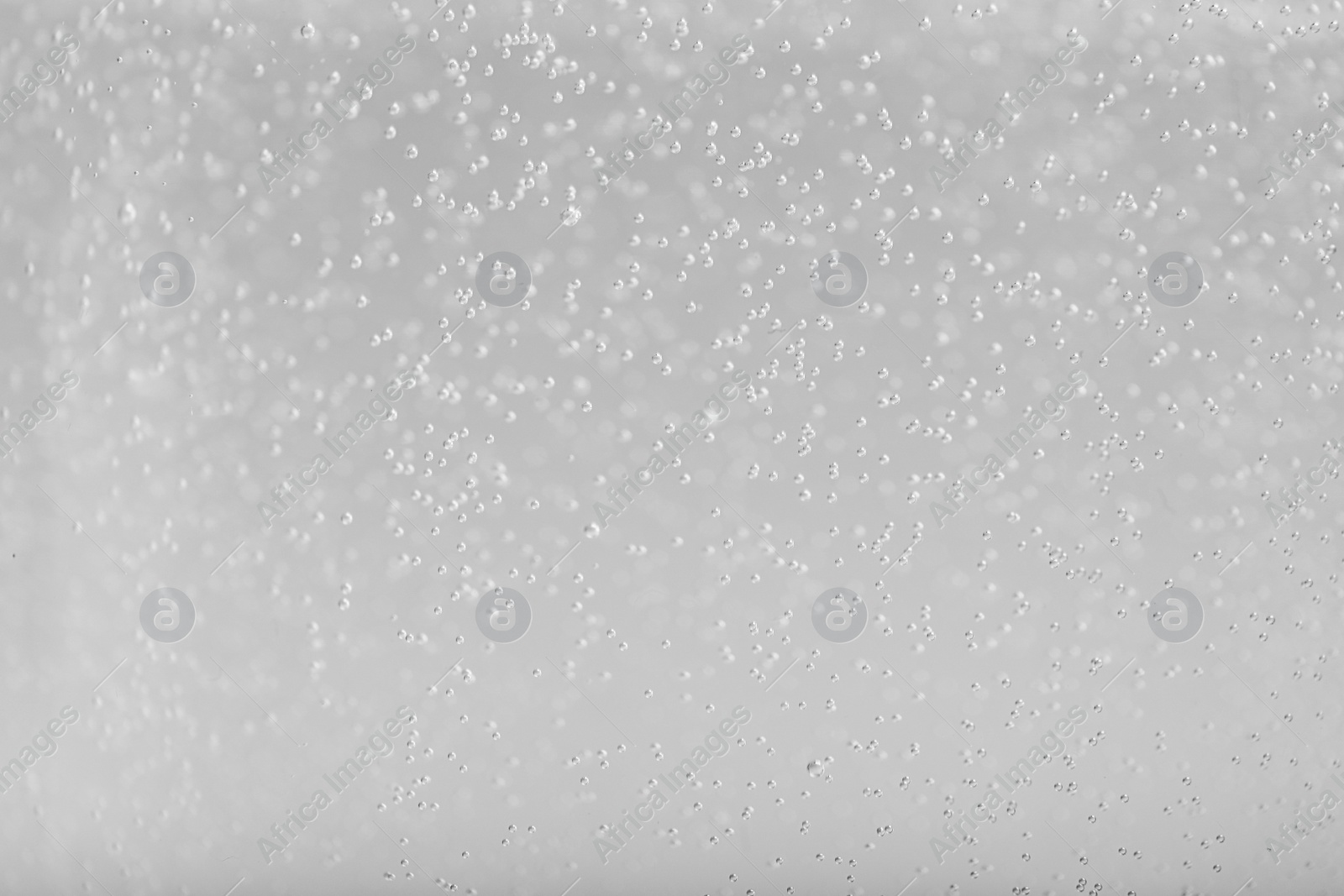 Photo of Soda water with bubbles of gas, closeup