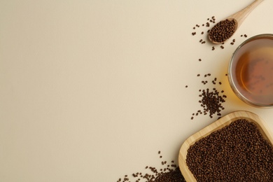 Buckwheat tea and granules on beige background, flat lay. Space for text