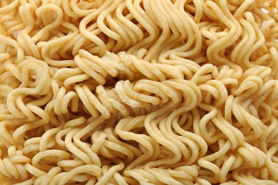 Photo of Quick cooking noodles as background, closeup view