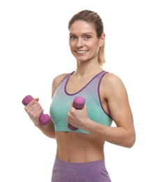 Portrait of sportswoman exercising with dumbbells on white background