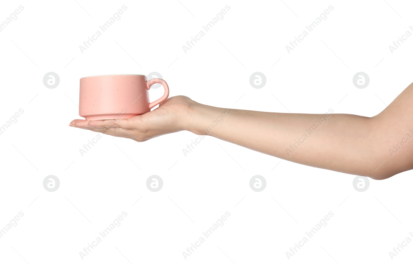 Photo of Woman holding pink ceramic cup on white background, closeup