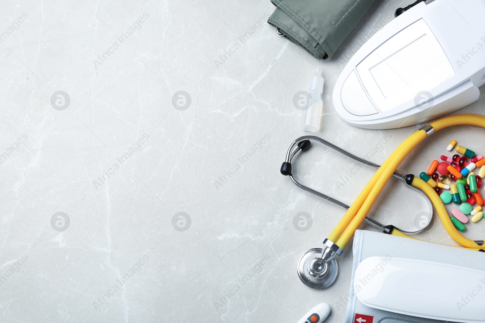 Photo of Flat lay composition with medical objects and space for text on grey background