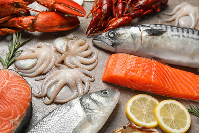 Photo of Fresh fish and seafood on marble table