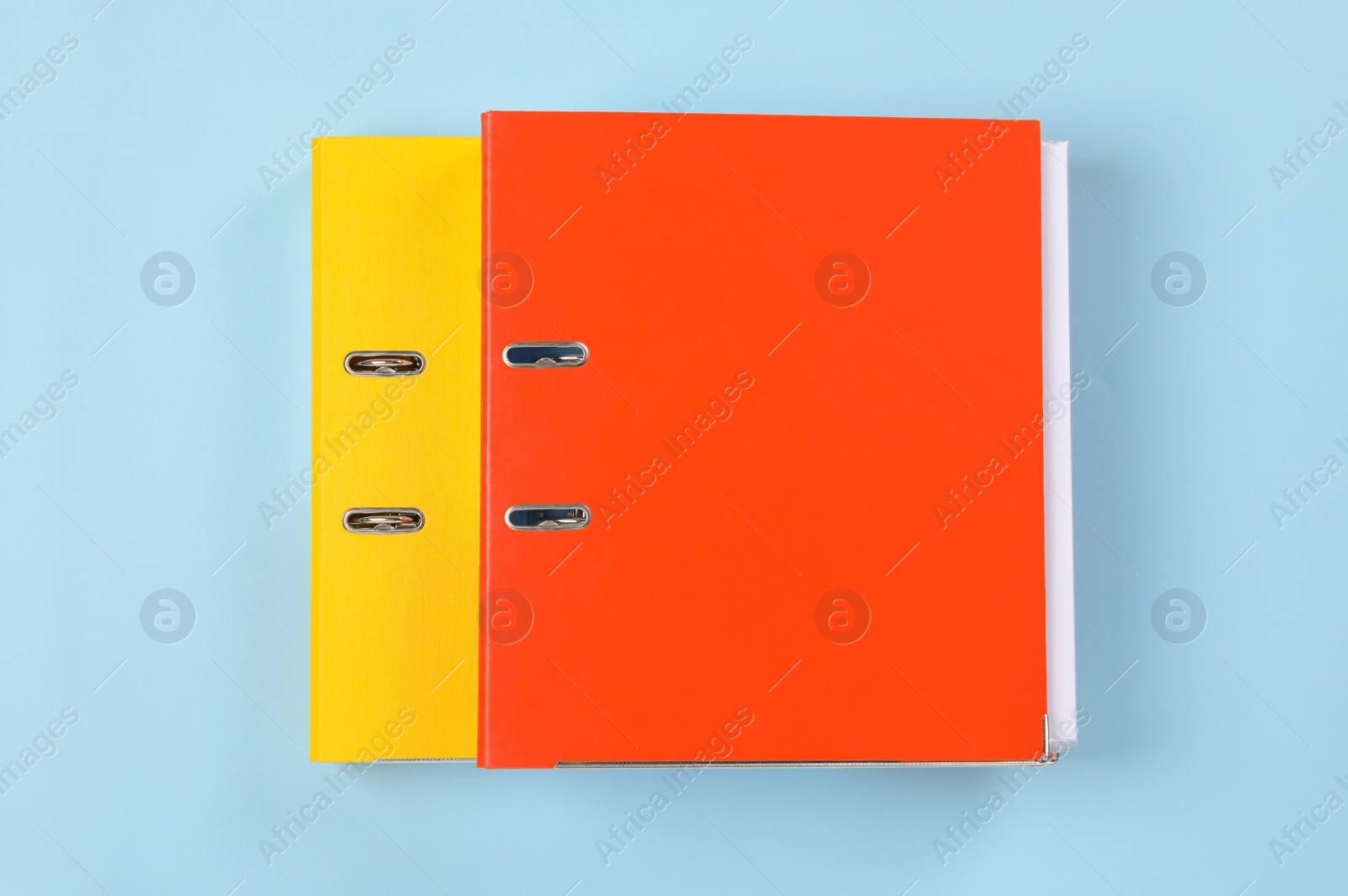 Photo of Office folders on light blue background, flat lay