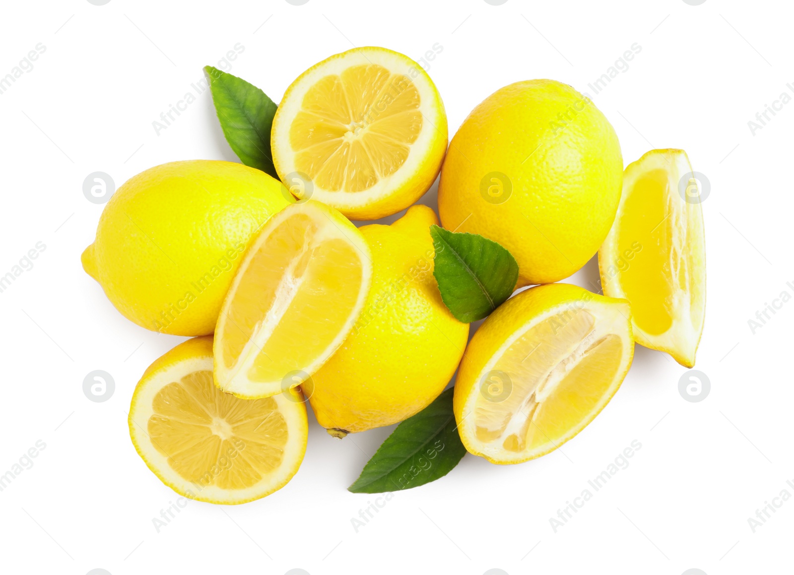 Photo of Cut and whole ripe lemons with green leaves on white background, top view