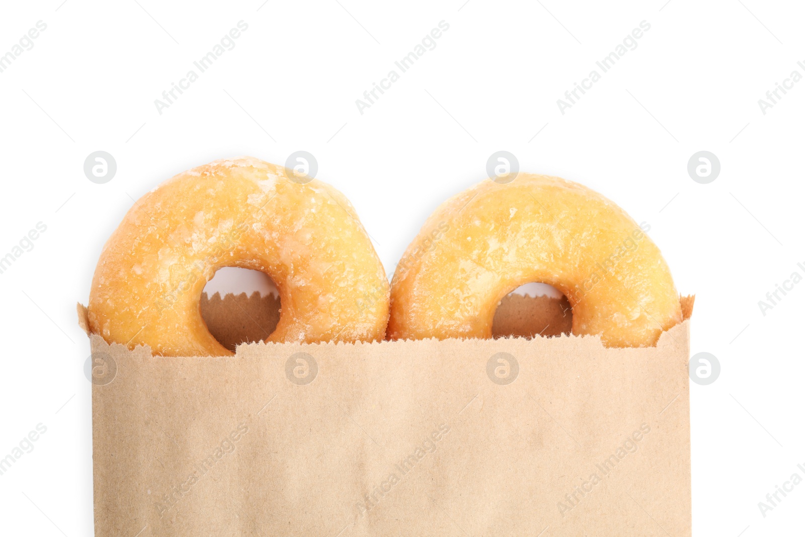 Photo of Delicious donuts in paper bag on white background, top view