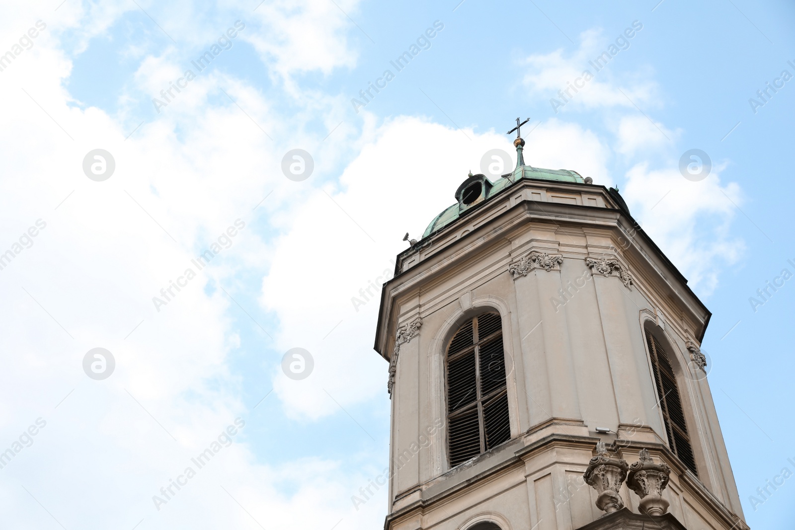 Photo of Exterior of beautiful cathedral against blue sky, low angle view