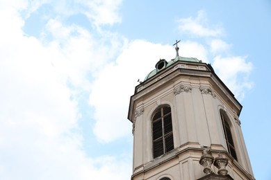 Exterior of beautiful cathedral against blue sky, low angle view