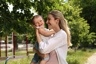 Photo of Happy mother with her daughter spending time together in park