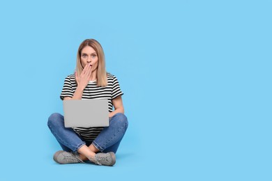 Photo of Emotional woman with laptop on light blue background. Space for text