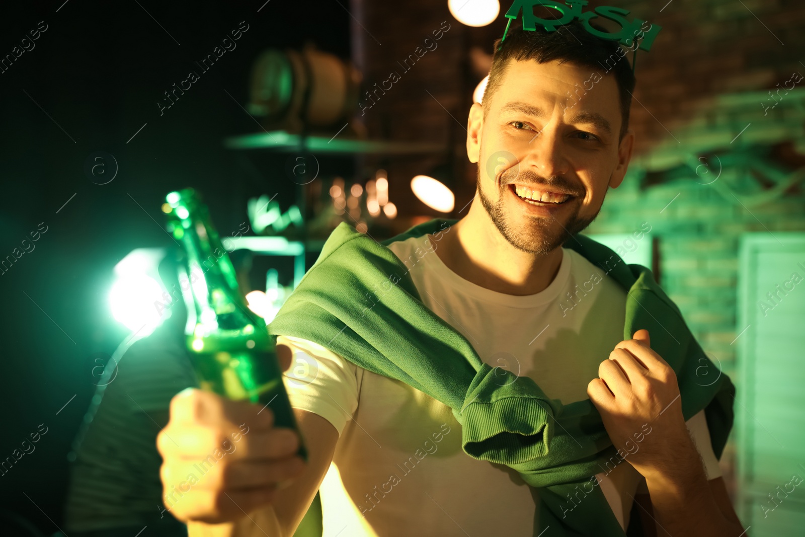 Photo of Man with beer celebrating St Patrick's day in pub