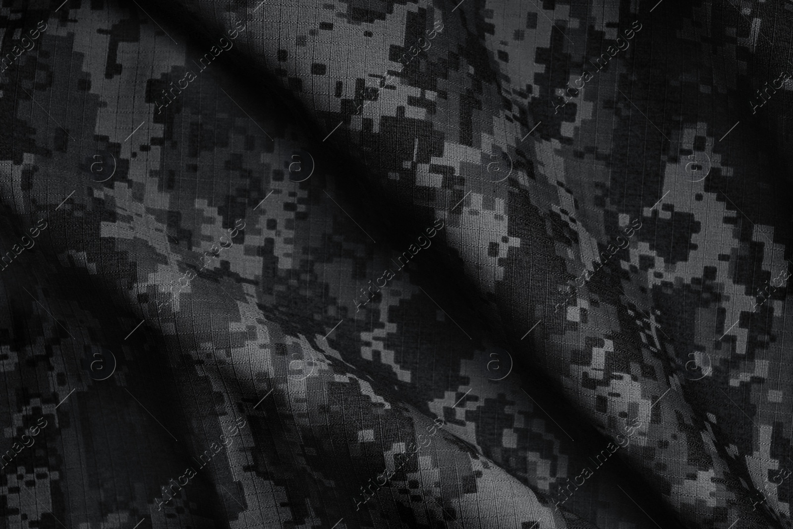 Image of Texture of crumpled camouflage fabric as background, top view. Black and white effect