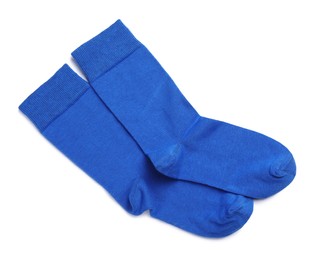 Photo of Pair of blue socks on white background, top view