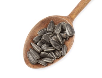 Photo of Raw organic sunflower seeds in wooden spoon isolated on white, top view