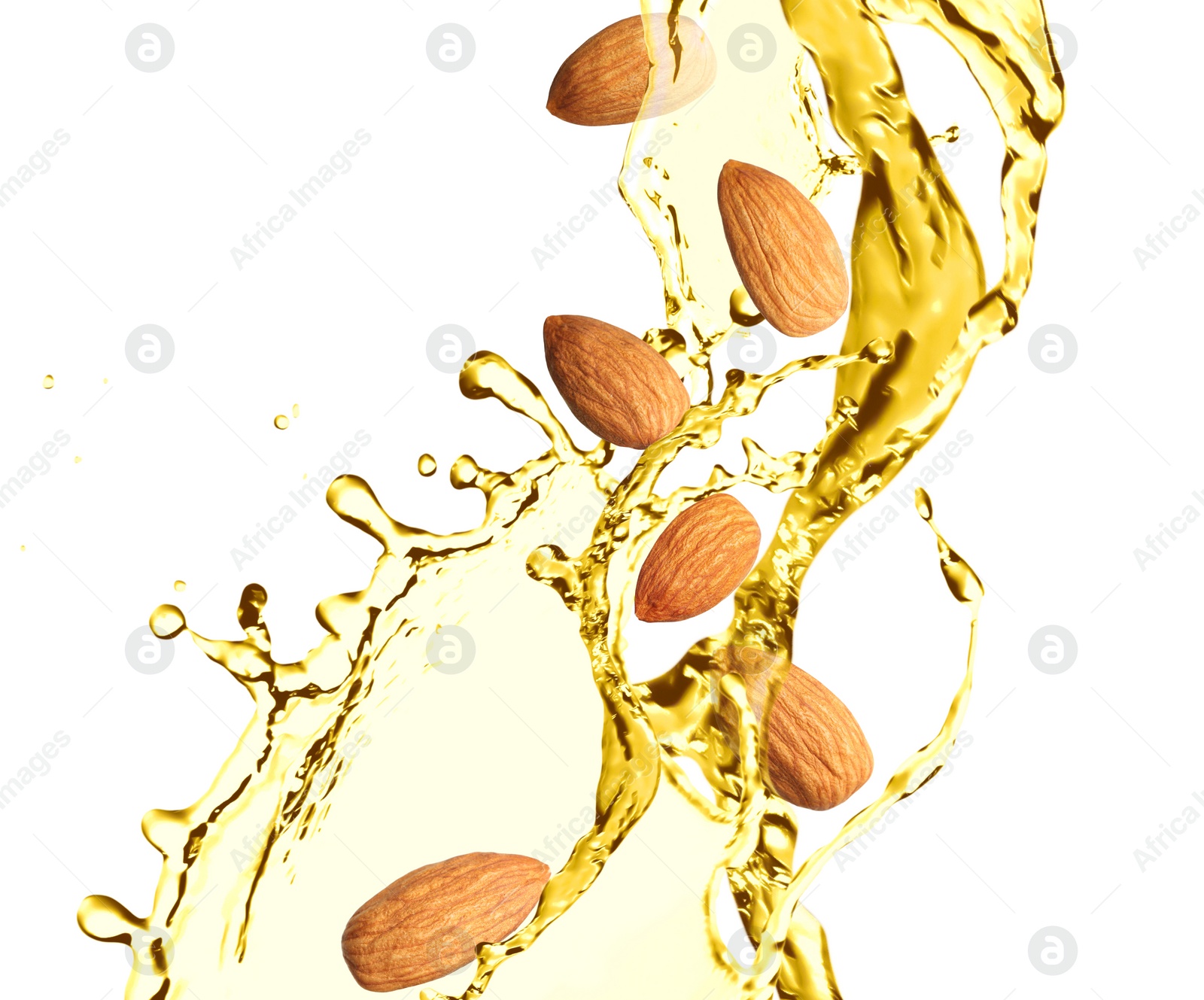 Image of Organic almond oil and tasty nuts flying on white background