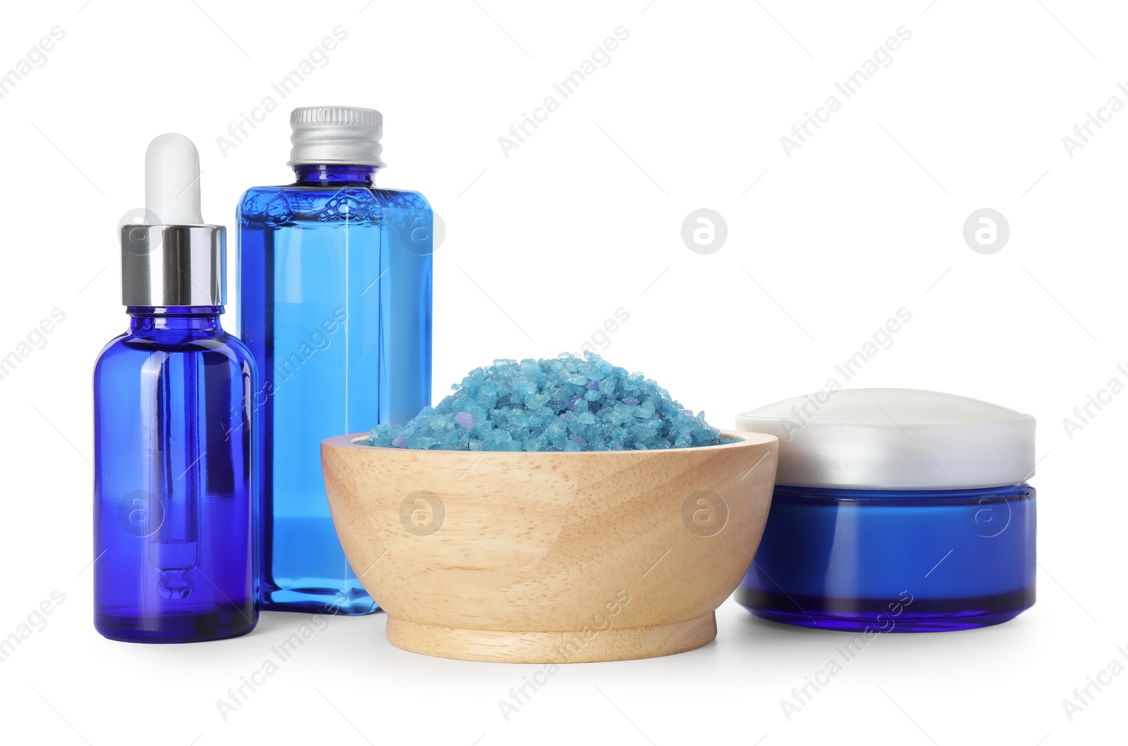 Photo of Spa composition. Cosmetic products and sea salt isolated on white