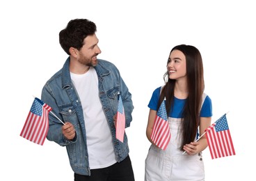 4th of July - Independence day of America. Happy father and his daughter with national flags of United States on white background