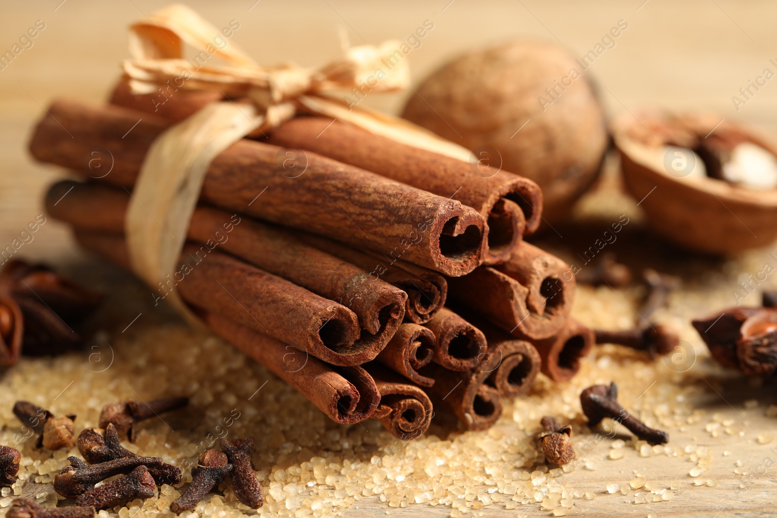 Photo of Different aromatic spices on table, closeup view
