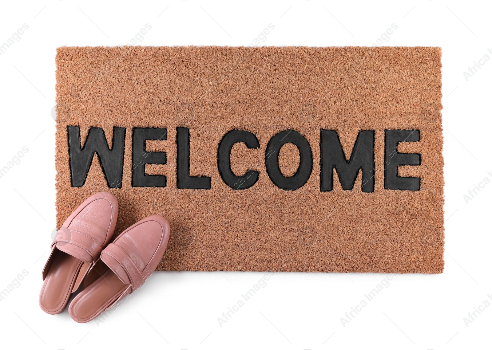 Photo of Stylish door mat with word Welcome and female shoes on white background, top view