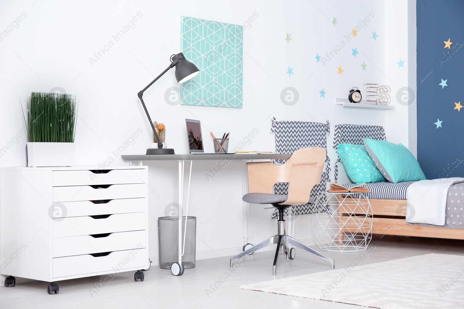 Photo of Modern child room interior with comfortable bed and desk