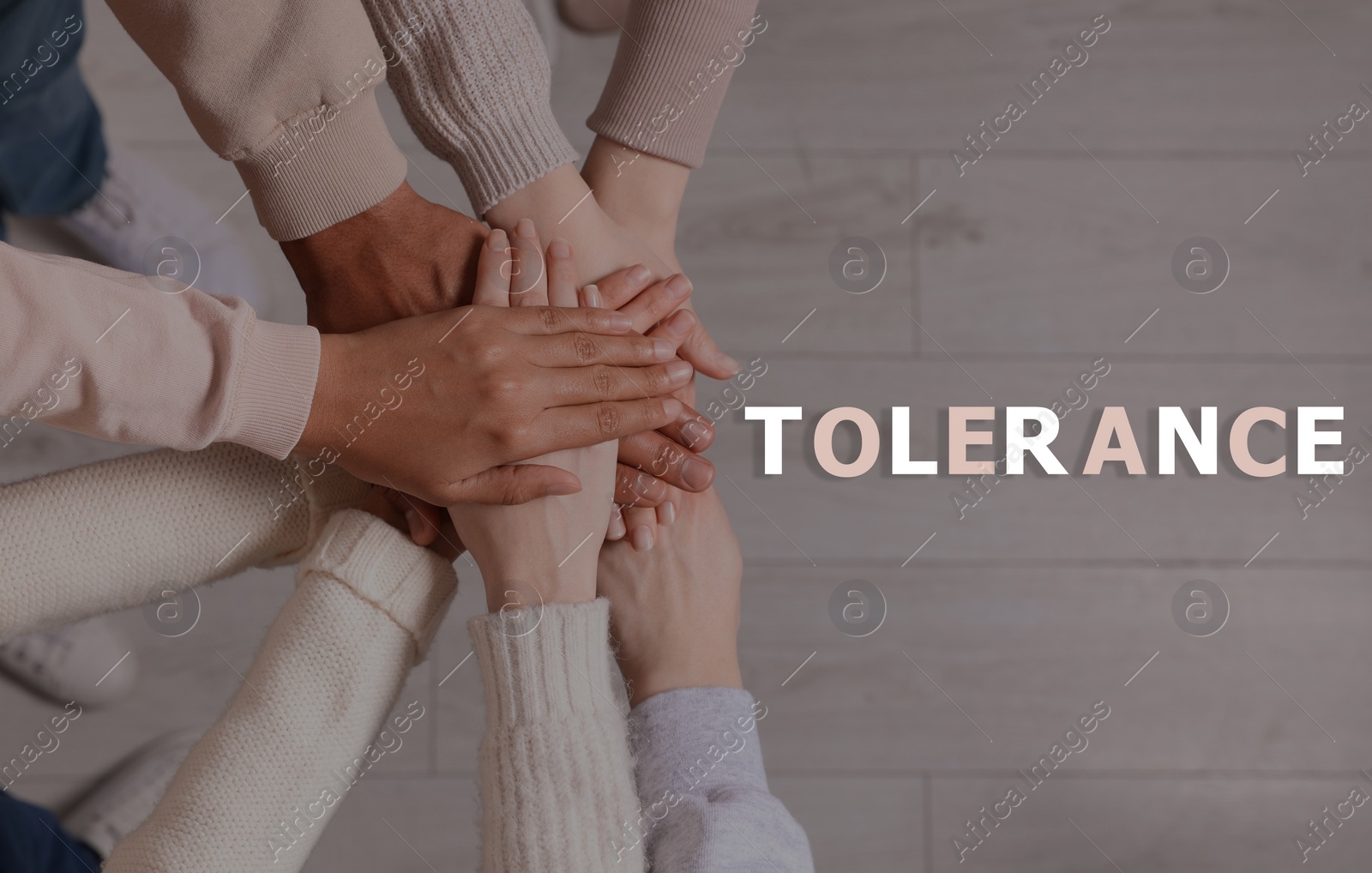 Image of Tolerance, support and cooperation concept. Group of multiracial people joining hands together, top view