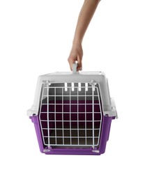 Photo of Woman holding violet pet carrier on white background, closeup