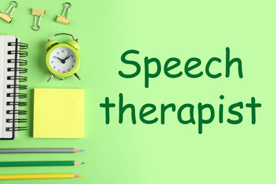 Modern office accessorises and text Speech therapist on green background, flat lay 