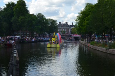 Photo of AMSTERDAM, NETHERLANDS - AUGUST 06, 2022: Many people at LGBT pride parade on river