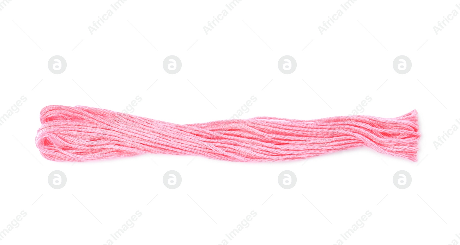 Photo of Bright pink embroidery thread on white background