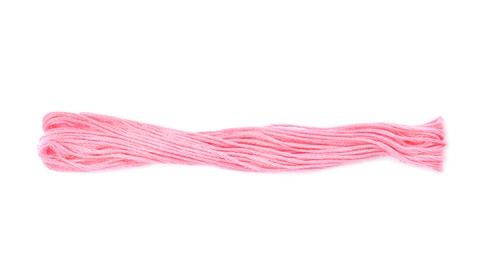 Bright pink embroidery thread on white background