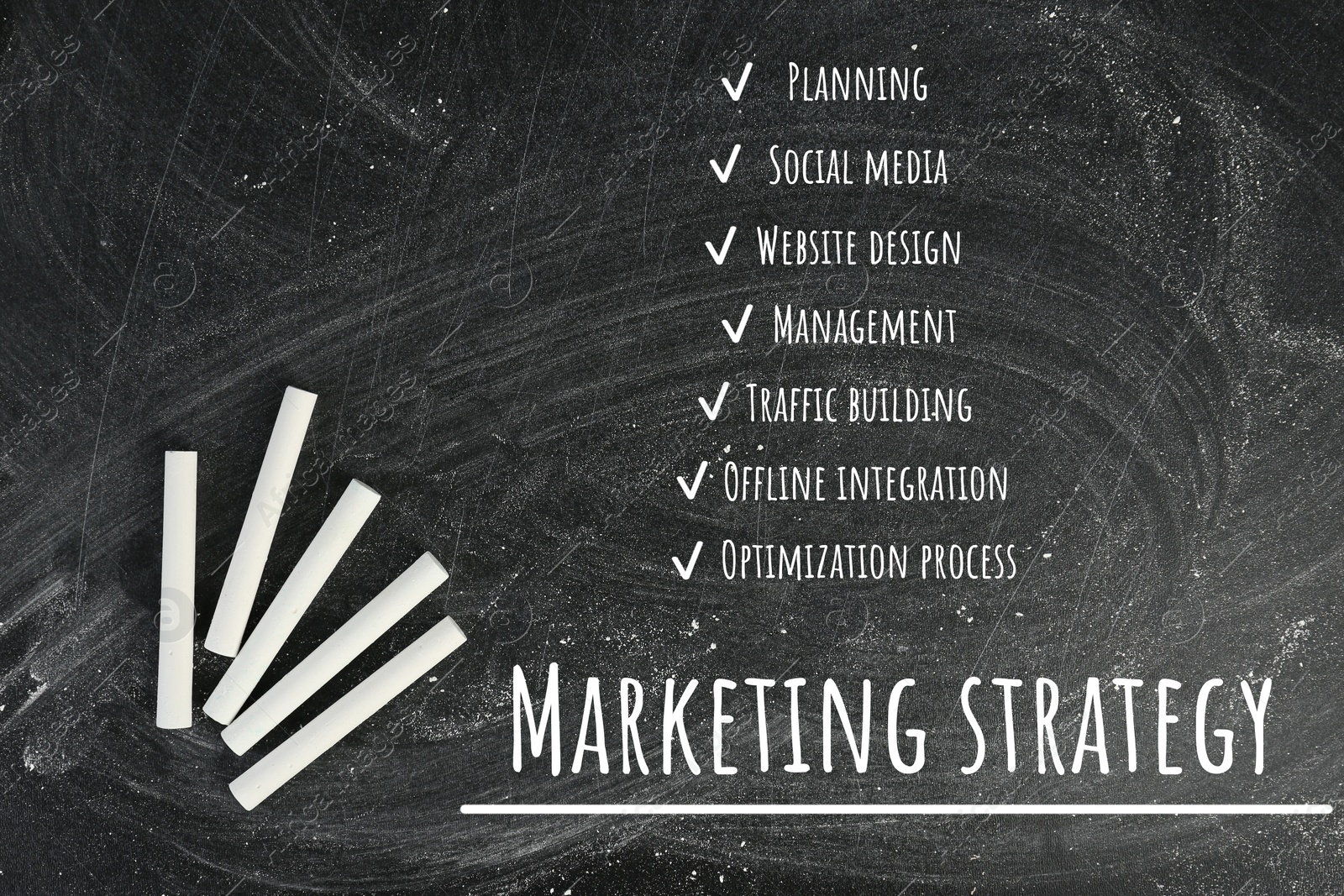 Image of Blackboard with pieces of chalk and marketing strategy plan, top view 