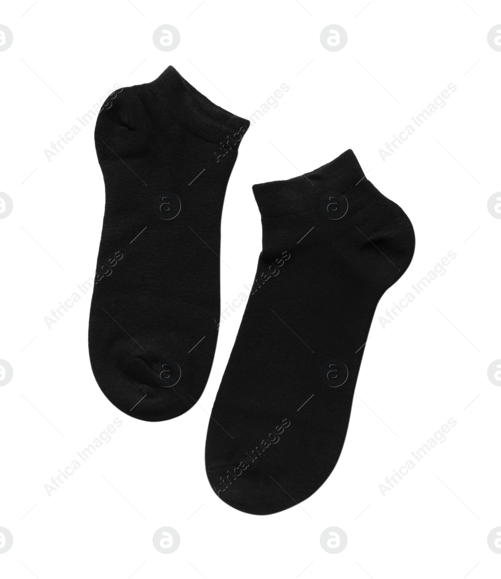 Photo of Pair of black socks on white background, top view