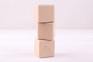 International Organization for Standardization. Wooden cubes with abbreviation ISO on white table, closeup