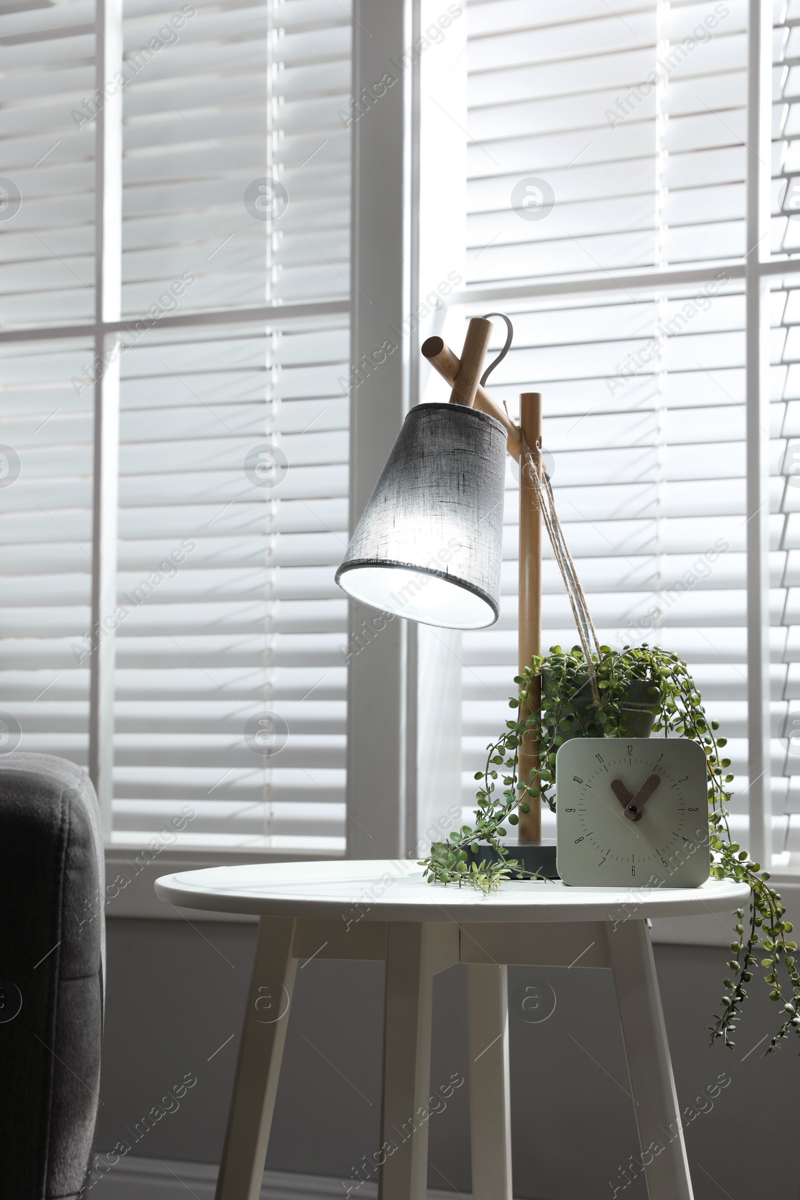 Photo of Room interior with stylish lamp and furniture