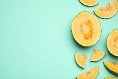 Flat lay composition with tasty melon on turquoise background, space for text