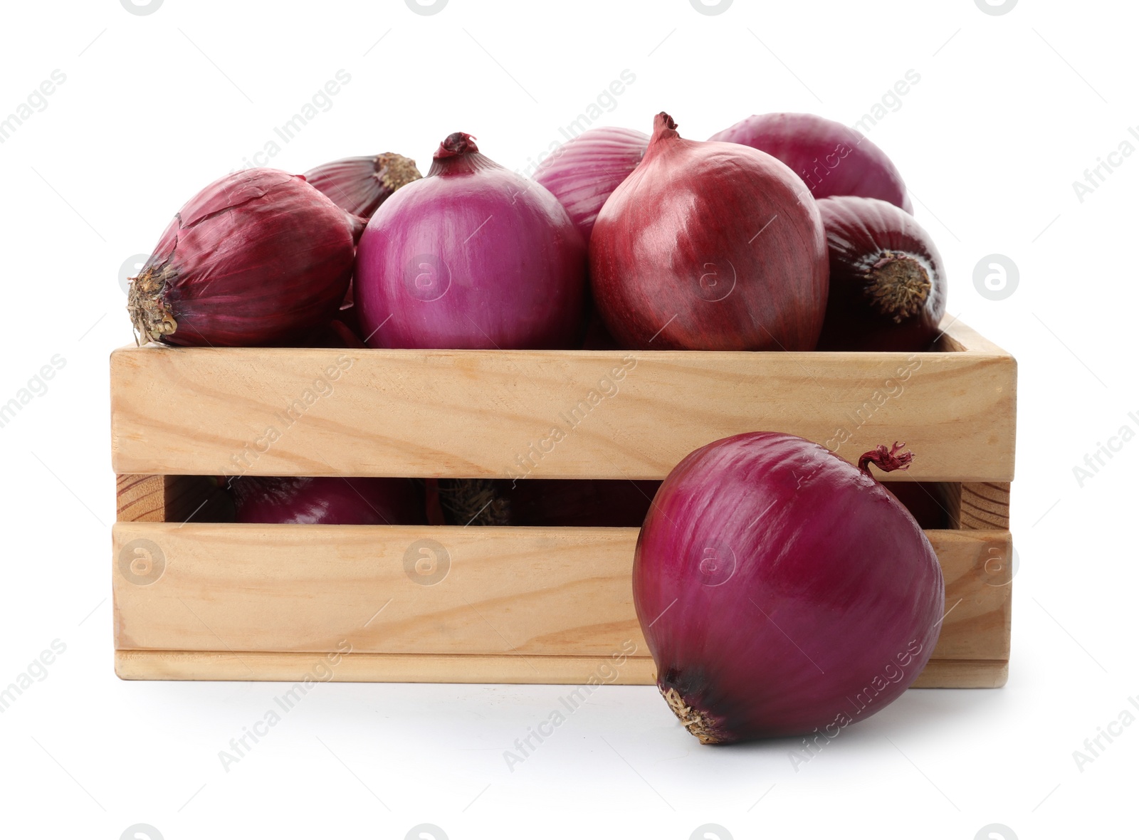 Photo of Ripe red onions in wooden crate isolated on white