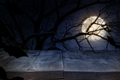 Wooden surface and bats flying in night sky with full moon. Halloween illustration