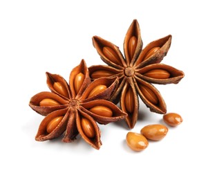 Photo of Dry anise stars with seeds on white background