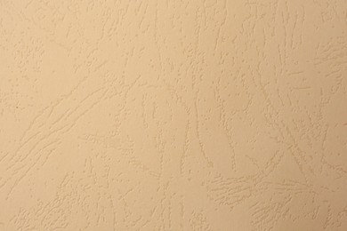 Photo of Sheet of beige paper as background, top view