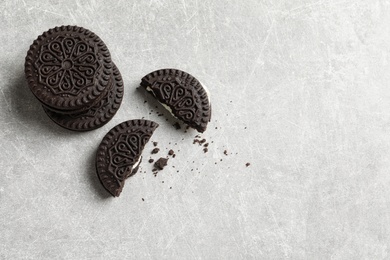 Photo of Tasty chocolate cookies on grey background, top view with space for text