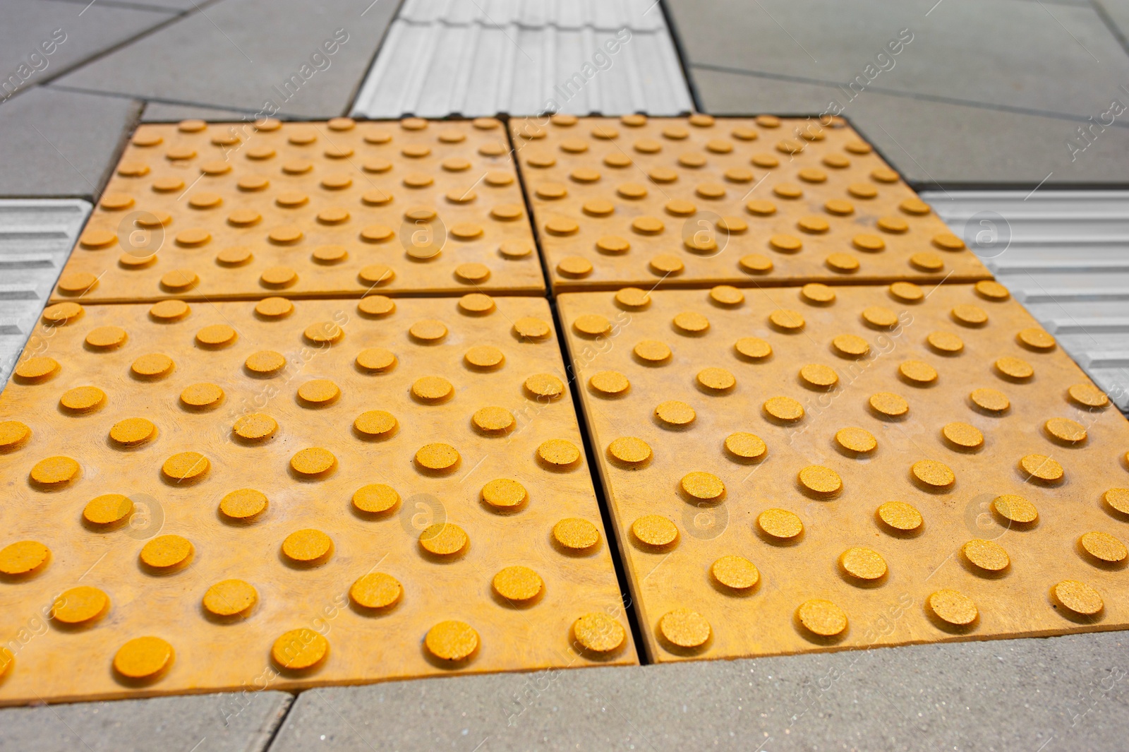 Photo of Tiles with tactile ground surface indicators, closeup view