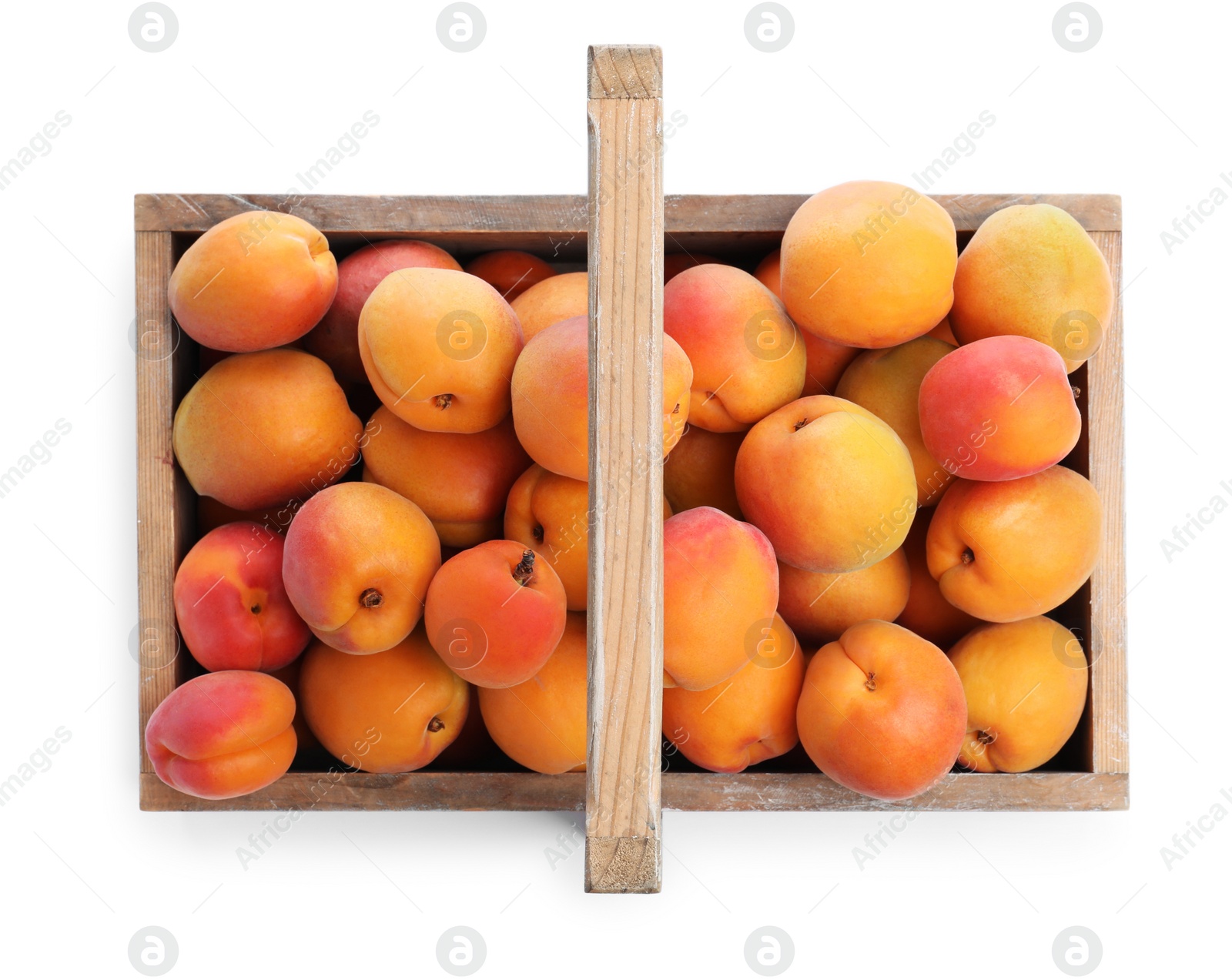 Photo of Delicious ripe apricots in wooden crate isolated on white, top view