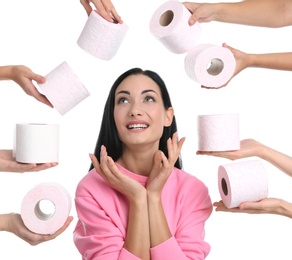 People offering toilet paper rolls to woman on white background