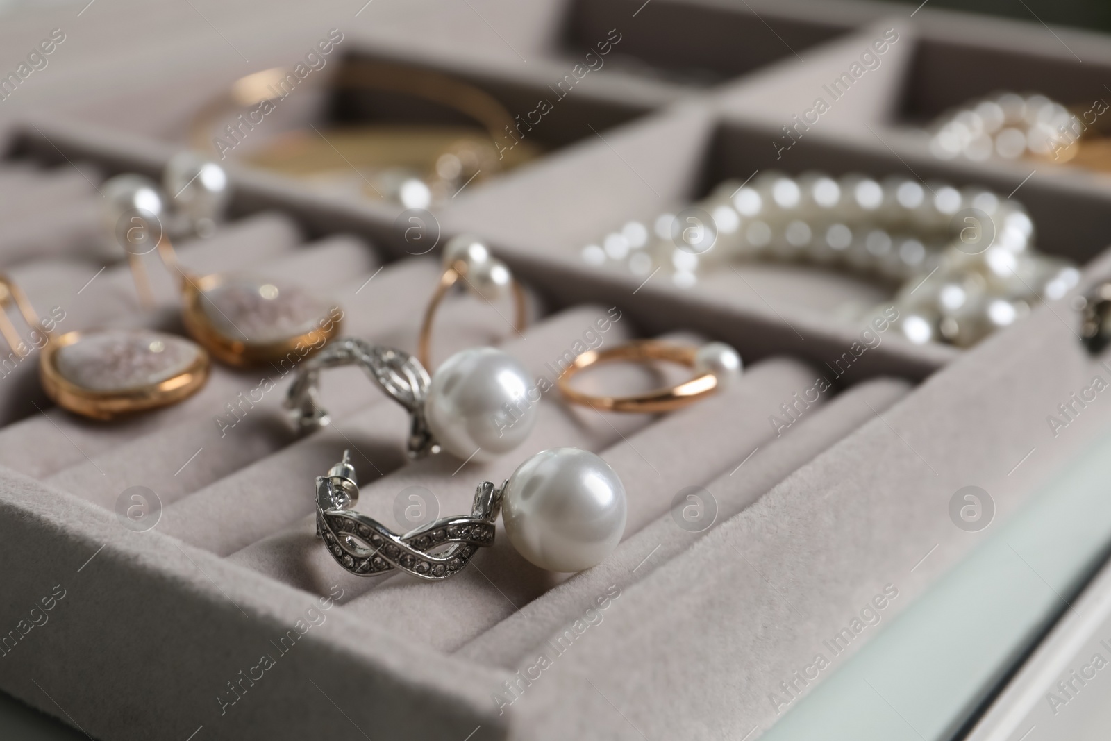 Photo of Box with luxurious pearl jewelry, closeup view